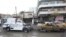 A destroyed vehicle is towed from the site of a bomb attack in Baghdad's Karrada district, Iraq, December 31, 2012. 