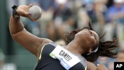 Michelle Carter competes in the final round of the women's shot put at the U.S. Olympic Track and Field Trials,, June 29, 2012, in Eugene, Oregon.