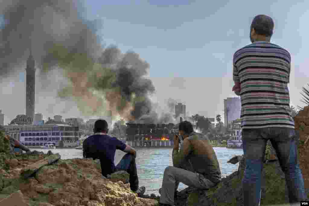 Flames consume a floating Nile restaurant, Aug 8, 2021, in Cairo. The blaze was reportedly caused by a short circuit during a heatwave. (Hamada Elrasam/VOA)