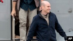 FILE - In this April 20, 2014 file photo, released French hostage Nicolas Henin arrives at the Villacoublay military airbase, outside Paris. He was released with other French journalists who had been held since June 2013.