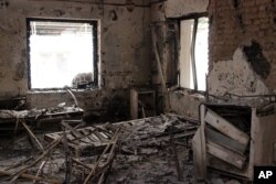 FILE - The charred remains of the Doctors Without Borders hospital is seen after it was hit by a U.S. airstrike in Kunduz, Afghanistan, Oct. 16, 2015.