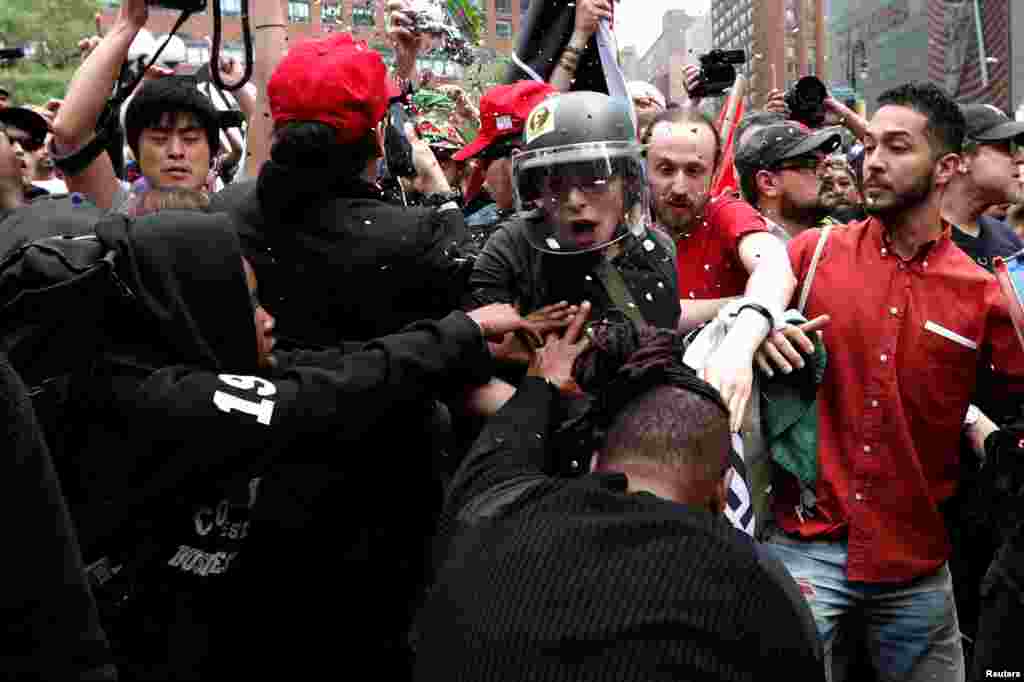 Demonstrators clash with people opposing their rally during a May Day protest in Union Square in New York City, May 1, 2017.