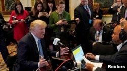 U.S. President Donald Trump answers a question during a radio interview on tax reform at the White House in Washington, Oct. 17, 2017.