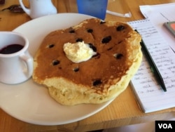 Ed Chasteen recommends the pancakes at Ginger Sue's - the diner he calls his office." (VOA/E. Sarai)