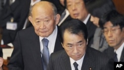 Japan's Prime Minister Naoto Kan attends lower house parliamentary session in Tokyo, 27 Jan 2011