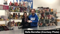 David Joffee from Nourish Now poses with Bella Berrellez. Nourish Now is a nonprofit organization that collects food from donors like restaurants and cafeterias and distributes it to families in need. 