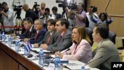 Josefina Vidal, the Cuban Foreign Ministry's chief diplomat for U.S. affairs, second from right, and members of her delegation participate in the first day of closed-door talks between Cuba and the U.S., Havana, Jan. 21, 2015. 