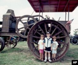 When a farmer climbs up on a tractor, it was a climb, even in the early days.