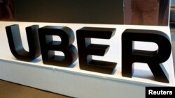 FILE - The logo of Uber is pictured during the presentation of their new security measures in Mexico City, Mexico, April 10, 2018. 