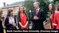 North Carolina State University Dean Jeff Braden shares a laugh with students after a class.