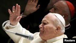 FILE - Pope John Paul II and Archbishop of Washington, Cardinal Theodore McCarrick, give their blessing at the end of the weekly general audience at the Paul VI hall in the Vatican, September 1, 2004. (REUTERS/Alessandro Bianchi//File Photo)