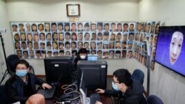 Software engineers work on a facial recognition system that identifies people when they wear a face mask at the development lab of the Chinese electronics manufacturer Hanwang.