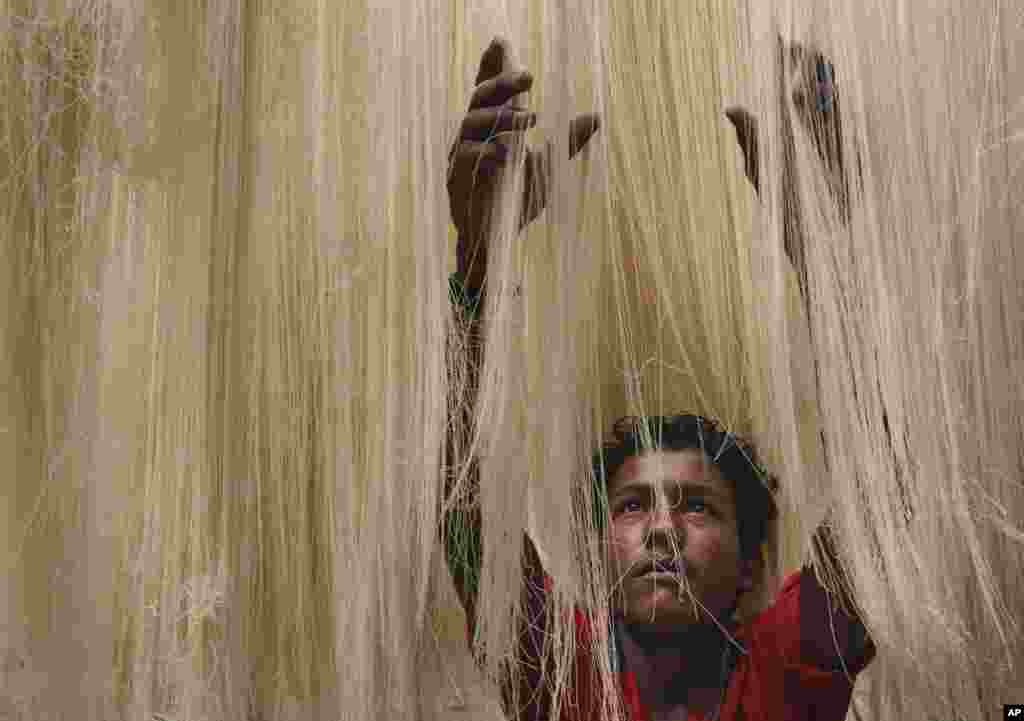 A worker dries vermicelli, used to make a traditional sweet dish popular during Ramadan, in Hyderabad, India, June 25, 2015. Muslims throughout the world are marking the holiest month in the Islamic calendar during which devotees fast from dawn till dusk.