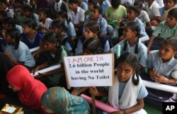 Indian school children participate in a rally to mark World Toilet Day in Hyderabad, India,.