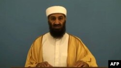 In a screen grab from a video released by the Office of the Director of National Intelligence (ODNI) on May 20, 2015, Osama Bin Laden rehearses a speech as he appears in a video document linked to "Bin Laden's Bookshelf," a package of declassified material.