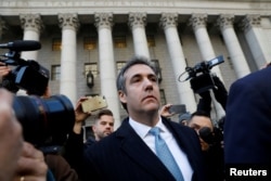 FILE - U.S. President Donald Trump's former personal lawyer Michael Cohen exits Federal Court after entering a guilty plea, in New York City, Nov. 29, 2018.