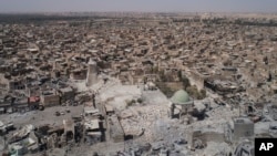 FILE - This aerial view shows the destroyed Grand al-Nuri mosque in the Old City of Mosul, Iraq, June 28, 2017.