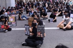 Malaysians take part in a rare anti-government rally in Kuala Lumpur on July 31, 2021, despite a tough Covid-19 coronavirus lockdown in place restricting gatherings and public assemblies.