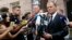 President of the European Council Donald Tusk (R) speaks to media next to the prosecutor's office in Warsaw, Poland, Aug. 3, 2017. 