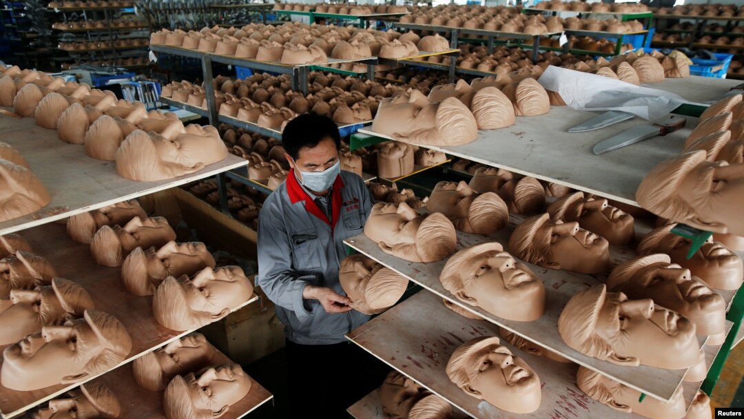 A worker checks a mask of U.S. Republican presidential candidate Donald Trump at Jinhua Partytime Latex Art and Crafts Factory in Jinhua, Zhejiang Province, China, May 25, 2016. 
