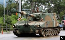 A South Korean army K-55 artillery vehicle moves through a exercise near the demilitarized zone between the two Koreas in Cheorwon, South Korea, Aug. 21, 2017.