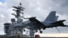 FILE - A F18 Super Hornet prepares to land on the deck of the USS Eisenhower off the coast of Virginia, December 10, 2015 in the Atlantic Ocean. 