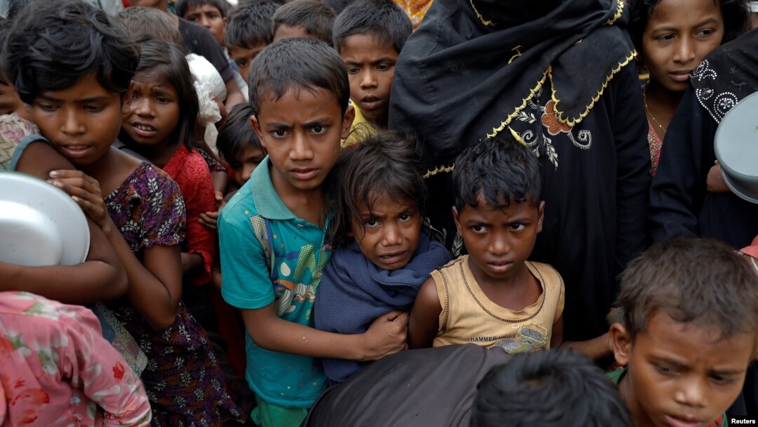 Rohingya refugees wait for food at Tengkhali camp near Cox's Bazar, Bangladesh, Dec. 8, 2017. The World Health Organization reports more than 110 suspected cases of diphtheria, including six deaths, have been clinically diagnosed.