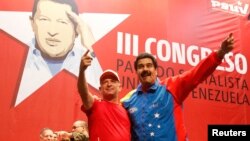 Venezuela's President Nicolas Maduro (R) embraces retired General Hugo Carvajal as they attend the Socialist party congress in Caracas, Venezuela, July 27, 2014.