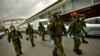 Members of the Military Emergency Unit, walking with special equipment to disinfect areas to prevent the spread of the coronavirus, arrive at Abando train station, in Bilbao, northern Spain, March 23, 2020. 