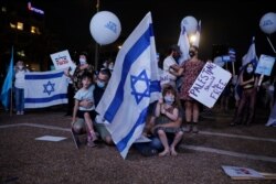 People take part in a protest against Israel's plan to annex parts of the West Bank, in Tel Aviv, Israel, June 23, 2020.