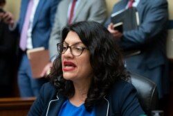 Rep. Rashida Tlaib, D-Mich., answers the roll call as the House Oversight Committee votes to hold Attorney General William Barr and Commerce Secretary Wilbur Ross in contempt, on Capitol Hill in Washington, June 12, 2019.