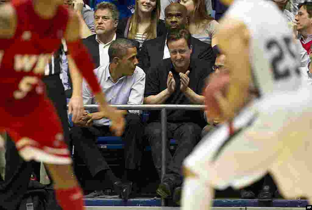 President Obama and Prime Minister Cameron attend the first round of the NCAA basketball tournament in Dayton, Ohio. (AP)