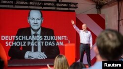  German Finance Minister, Vice-Chancellor and the Social Democratic Party's (SPD) main candidate Olaf Scholz stands on stage during an election campaign event in Goettingen, Sept. 4, 2021. 
