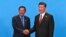Cambodian Prime Minister Hun Sen, left, and Chinese President Xi Jinping, right, shake hands during the welcome ceremony for the Belt and Road Forum, at the International Conference Center at Yanqi Lake in Beijing, Monday, May 15, 2017. (Roman Pilipey/Pool Photo via AP)