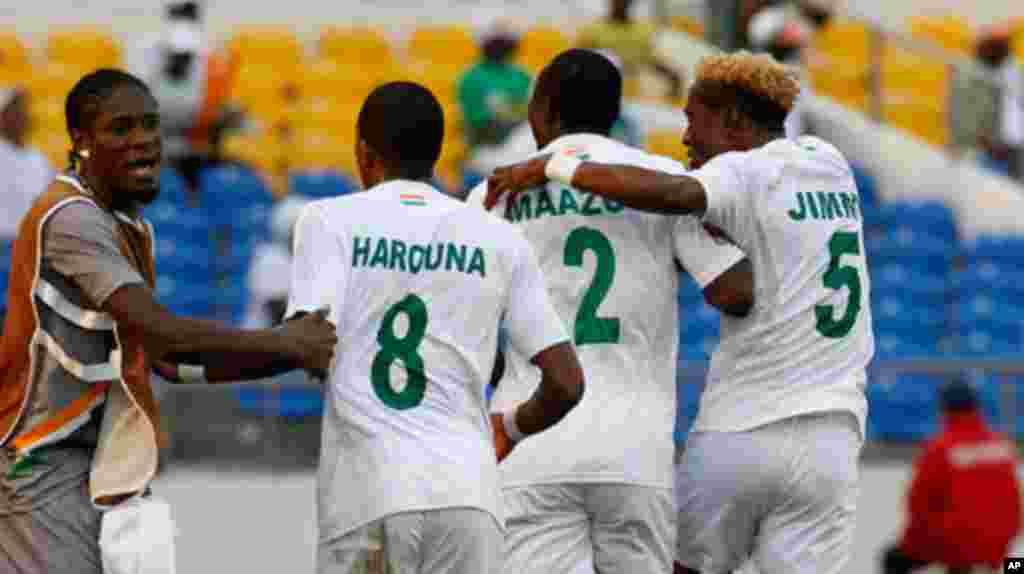 Niger's Moussa celebrates his goal against Tunisia with teammates during their African Cup of Nations soccer match in Libreville