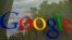 FILE - The Google logo on a window at the company's headquarters in Mountain View, California. 