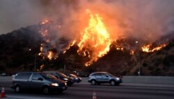 The Getty Fire burns near the Getty Center along the 405 freeway north of Los Angeles, California, Oct. 28, 2019.