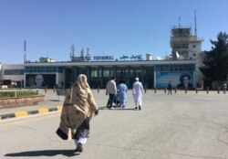 FILE - People arrive at the domestic terminal of the Hamid Karzai International Airport in Kabul, May 8, 2018.