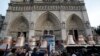 Onlookers witness the delivery of Notre Dame's new bells, Paris, January 31, 2013.