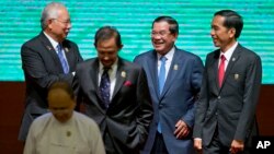 Leaders of Association of Southeast Asian Nations (ASEAN) from left, Malaysian Prime Minister Najib Razak, Sultan of Brunei Hassanal Bolkiah, Cambodian Prime Minister Hun Sen, and Indonesian President Joko Widodo walk back to their seats after posing for a group photo during the opening ceremony of the 25th ASEAN summit at Myanmar International Convention Center in Naypyitaw, Myanmar, file photo. 