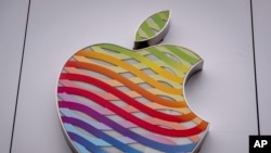 FILE - The logo of the Apple company in rainbow colors is pictured at a company's store in Frankfurt, Germany, July 31, 2023.