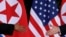 FILE - U.S. President Donald Trump and North Korea's leader Kim Jong Un meet at the start of their summit on the resort island of Sentosa, Singapore, June 12, 2018. 