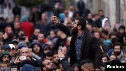 Palestinians take part in a protest against the Palestinian authority, in the West Bank city of Ramallah, March 13, 2017. 