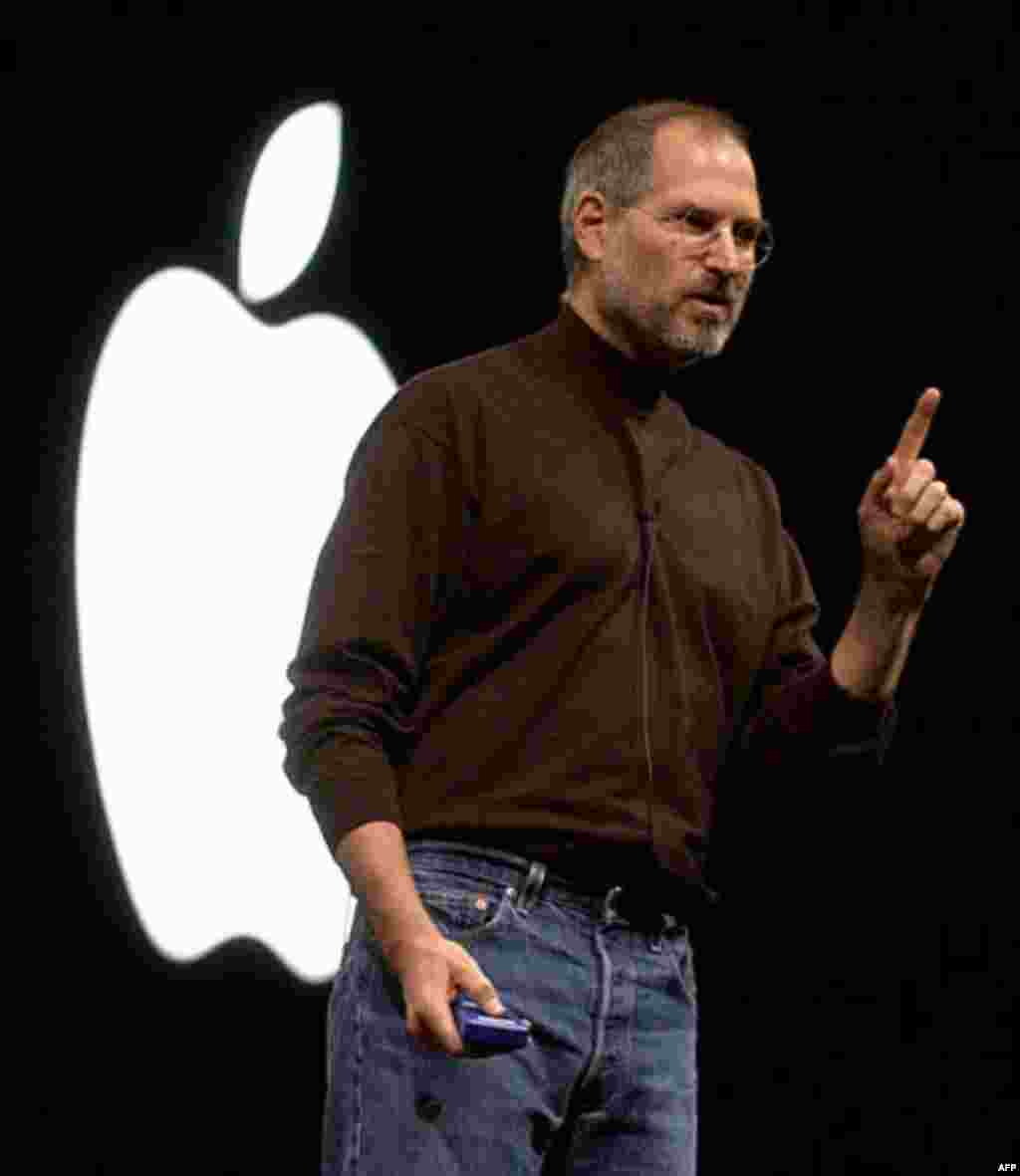 Apple Computer, Inc., CEO Steve Jobs gestures Thursday, Oct. 16. 2003, during a media presentation in San Francisco. In a move to reach the broader market of Microsoft-platform users, Jobs unveiled a fully Windows-compatible Apple iTunes Music Store, whic