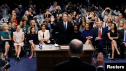 U.S. Supreme Court nominee Judge Brett Kavanaugh is sworn in by committee Chairman Chuck Grassley to testify during his U.S. Senate Judiciary Committee confirmation hearing on Capitol Hill in Washington, U.S.