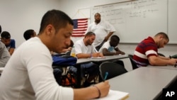 In this April 13, 2010 photo, Professor Derron Bowen teaches high school math to college students in the Broward County Community College math building in Davie, Fla. (AP Photo/J Pat Carter) 