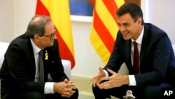 Spain's Prime Minister Pedro Sanchez, right, meets Catalan regional president, Quim Torra, left, at the Moncloa palace in Madrid, July 9, 2018.