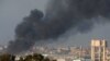 Smoke rises inside central Gaza strip following an airstrike, as seen from southern Israel