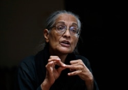 Pakistan's prominent rights activist Tahira Abdullah speaks about violence against women during an interview with The Associated Press in Islamabad, Pakistan, July 27, 2021.