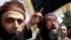FILE - Members of Jordan's Salafi jihadi shout slogans during a demonstration against prolonged detention of the group's leaders in Amman, Jordan, April 9, 2013.